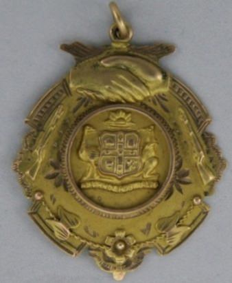 Gold fob Presented to Brother F W GIBSON