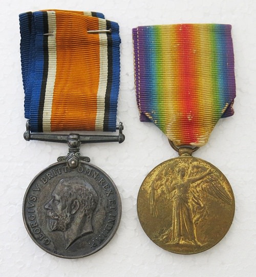 War Medal:42492 and Victory Medal:41602 to SGT 561 C SMITH 35BN AIF